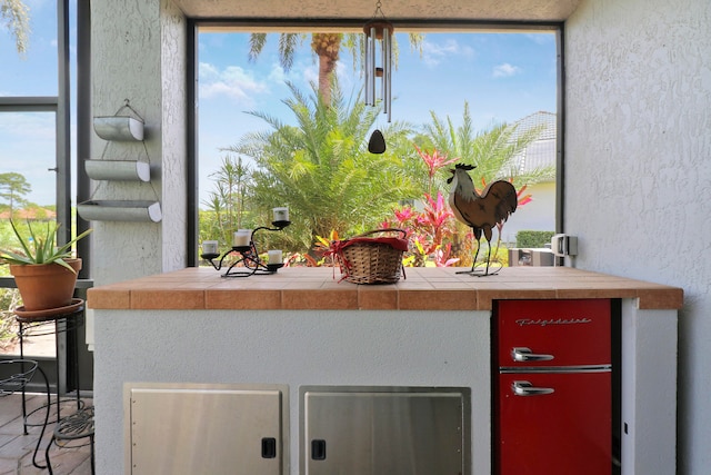 interior space featuring tile countertops