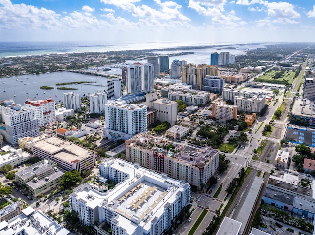 birds eye view of property with a water view