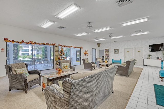 tiled living room with ceiling fan