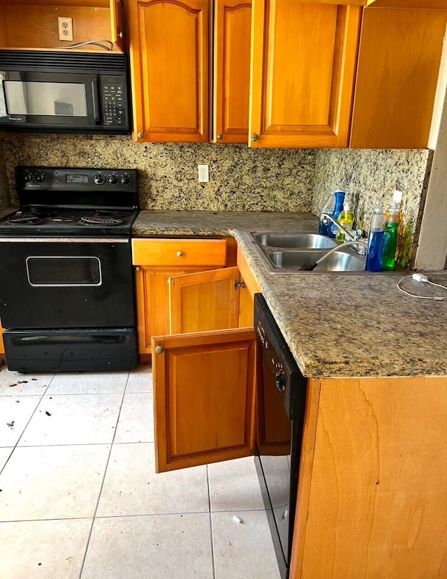 kitchen with black appliances, backsplash, light tile patterned flooring, and sink