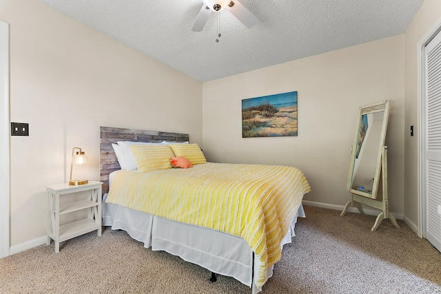 bedroom with a closet, ceiling fan, a textured ceiling, and carpet floors