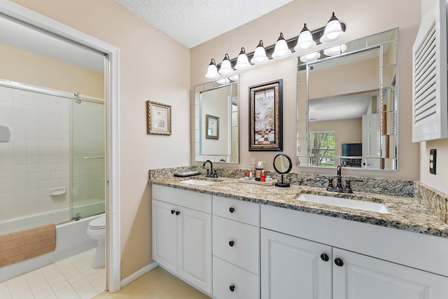 full bathroom featuring toilet, tile patterned flooring, vanity, enclosed tub / shower combo, and a textured ceiling