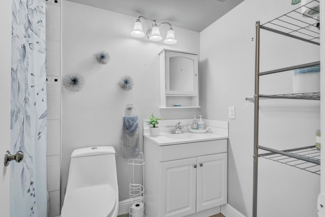 bathroom with vanity, toilet, and a shower with curtain