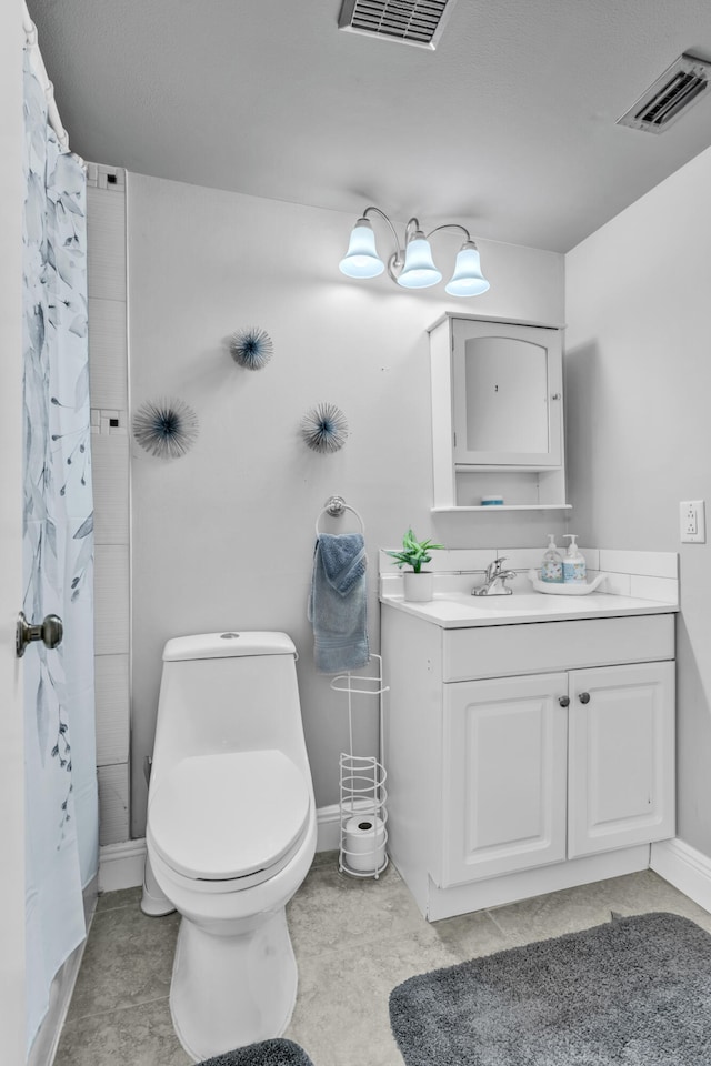 bathroom featuring vanity, curtained shower, and toilet