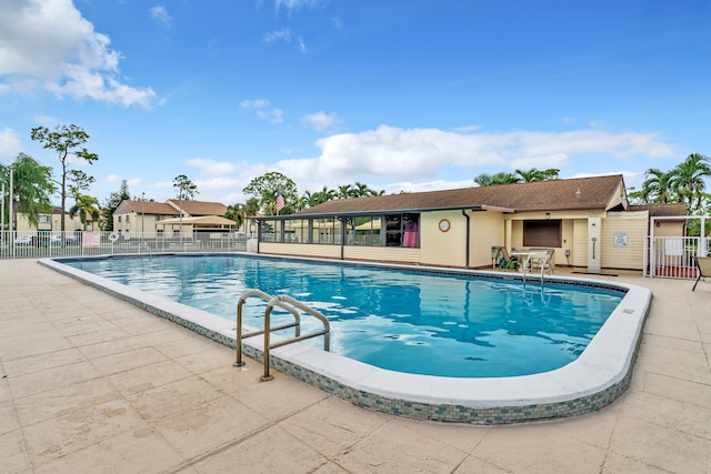 view of swimming pool with a patio area