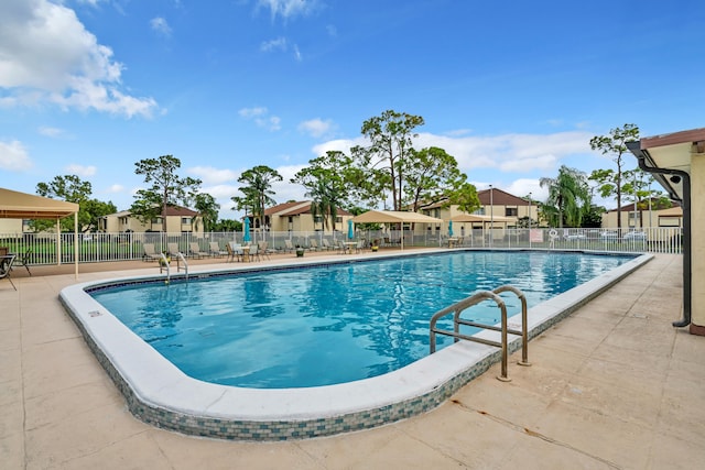 view of swimming pool featuring a patio area