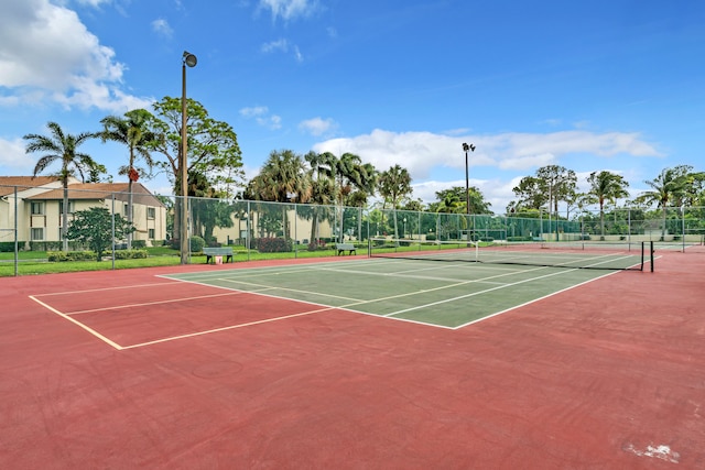 view of tennis court featuring basketball court