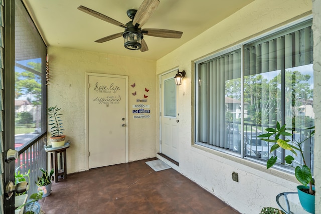 entrance to property featuring ceiling fan