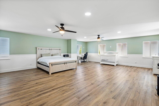 bedroom featuring ceiling fan and wood-type flooring