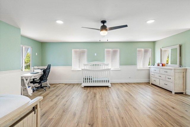 bedroom featuring light hardwood / wood-style flooring and ceiling fan