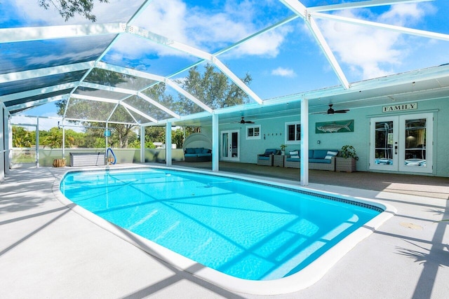 view of pool featuring french doors, an outdoor living space, a lanai, a patio area, and ceiling fan