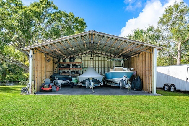 view of parking with a yard and a carport