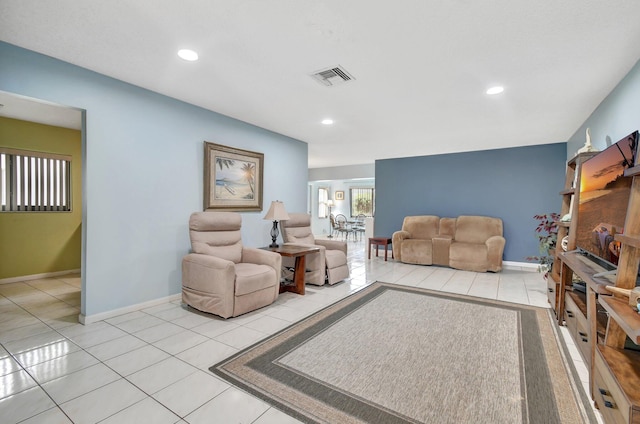 living room with light tile patterned flooring