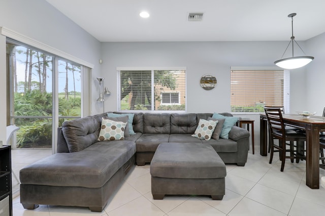 tiled living room with plenty of natural light