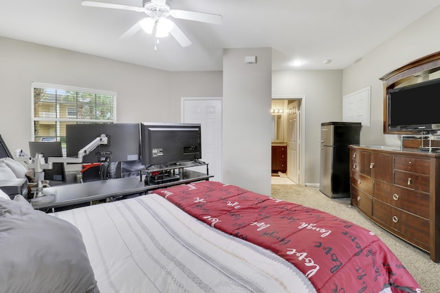 bedroom featuring light carpet, stainless steel fridge, and ceiling fan