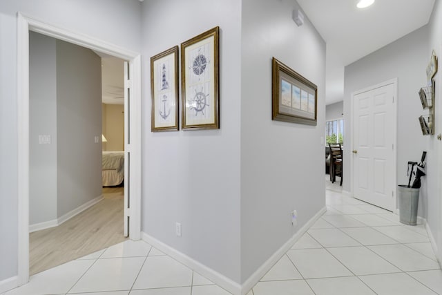 hall with light tile patterned flooring