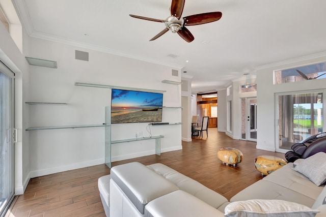 living room with ceiling fan, ornamental molding, and dark hardwood / wood-style flooring