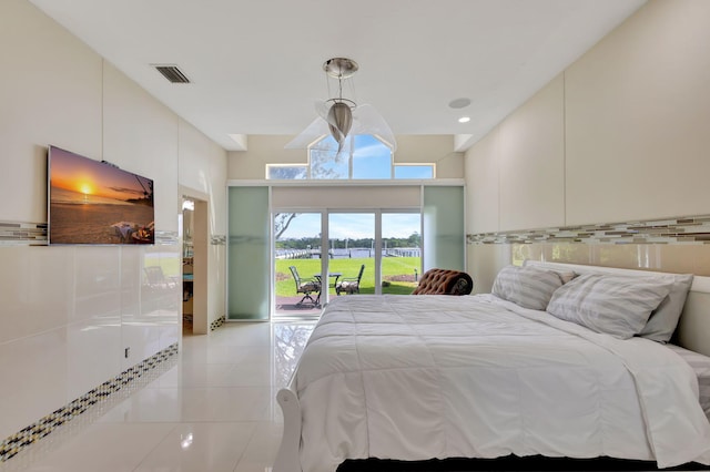 unfurnished bedroom featuring access to outside and light tile patterned flooring