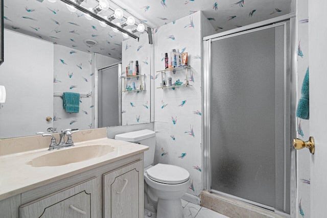 bathroom with walk in shower, vanity, and toilet