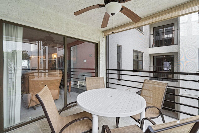 balcony featuring ceiling fan