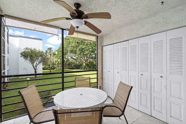 sunroom / solarium with ceiling fan