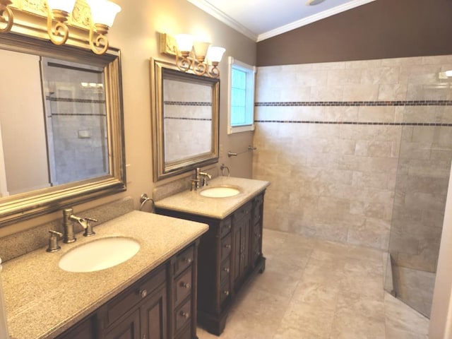 bathroom featuring vanity, ornamental molding, and lofted ceiling