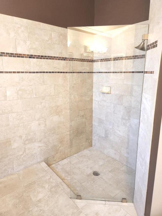 bathroom with a tile shower