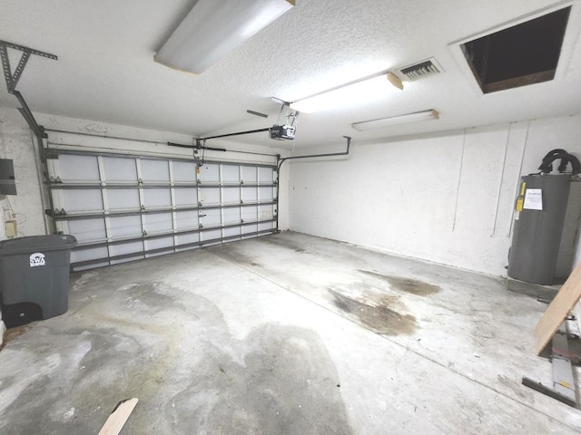 garage featuring a garage door opener and electric water heater