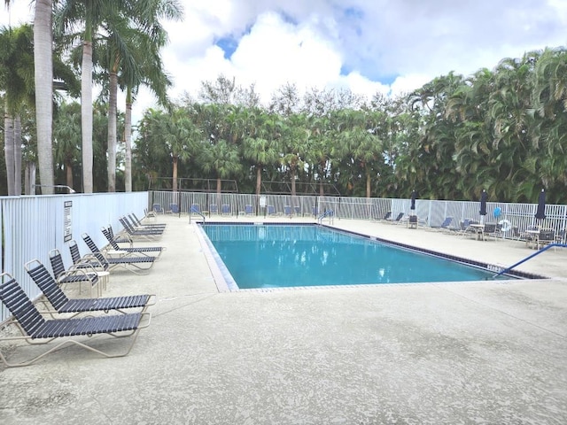 view of swimming pool with a patio area