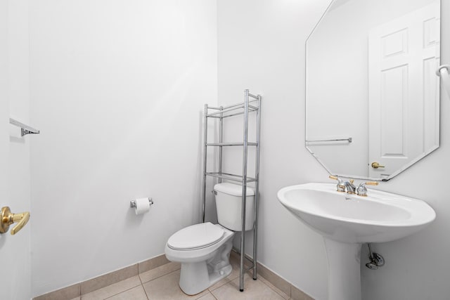 bathroom with tile patterned floors and toilet