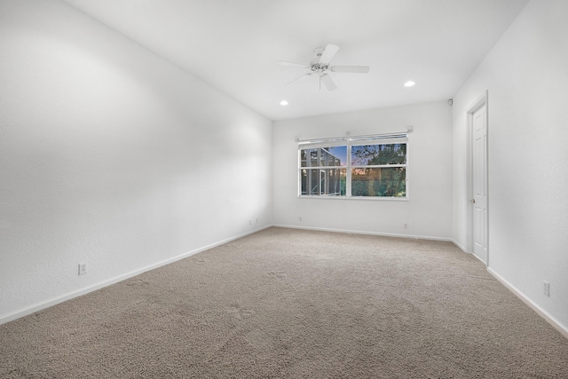 unfurnished room featuring carpet floors and ceiling fan