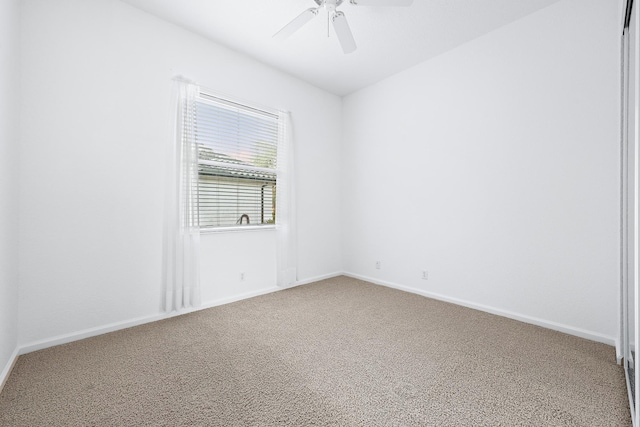 spare room with ceiling fan and carpet floors