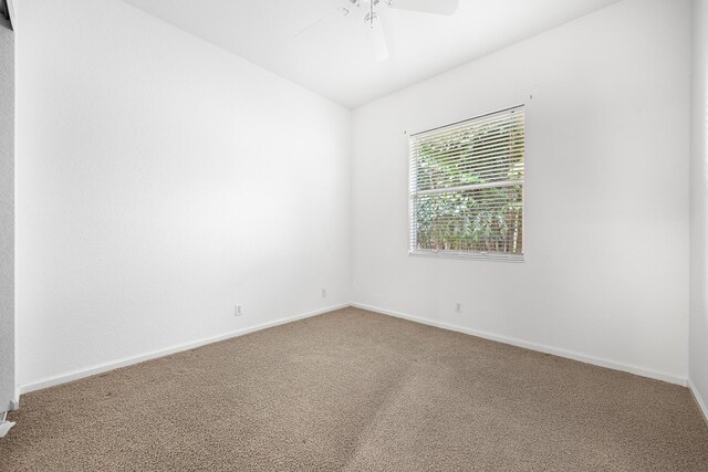 empty room with carpet and ceiling fan