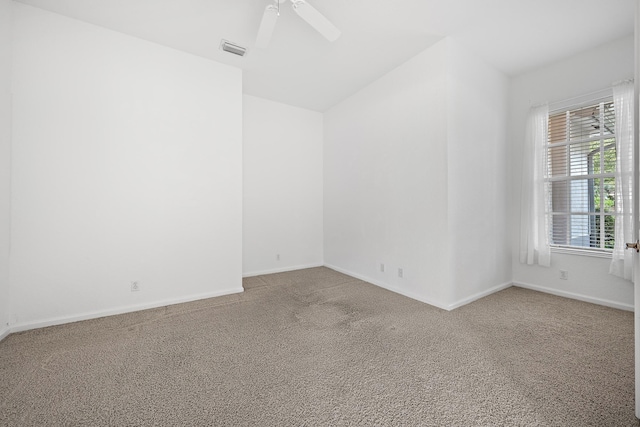 carpeted empty room with ceiling fan