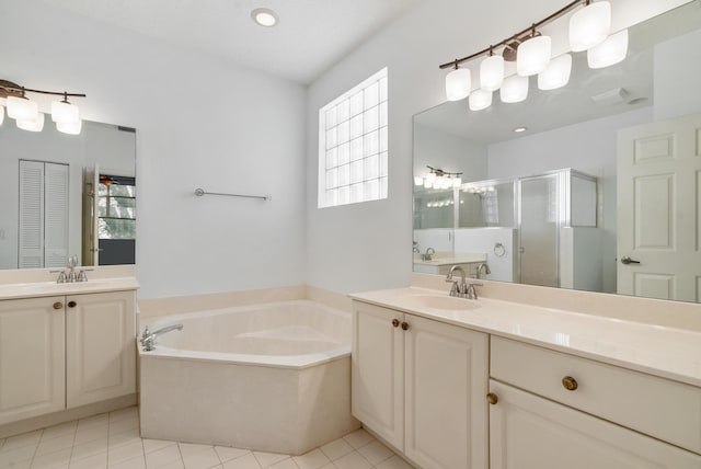 bathroom featuring vanity, shower with separate bathtub, and tile patterned flooring