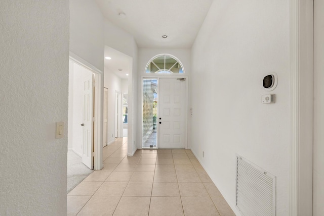 entrance foyer with light tile patterned floors