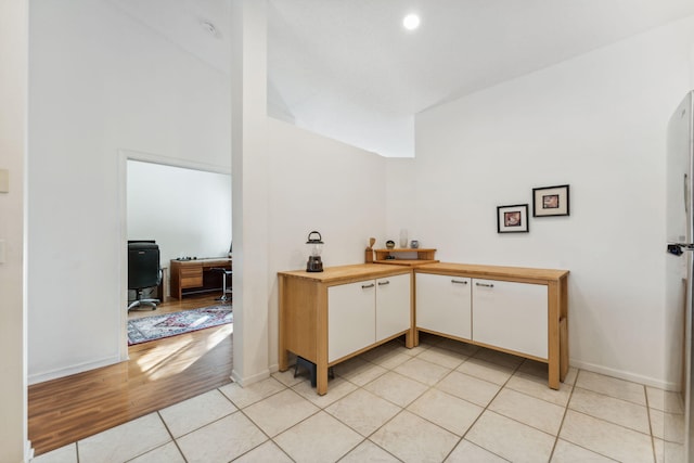 office featuring light tile patterned floors and baseboards