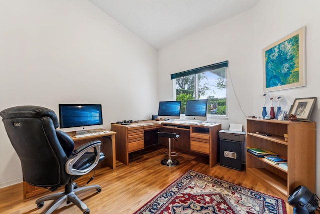 office featuring vaulted ceiling and dark wood finished floors