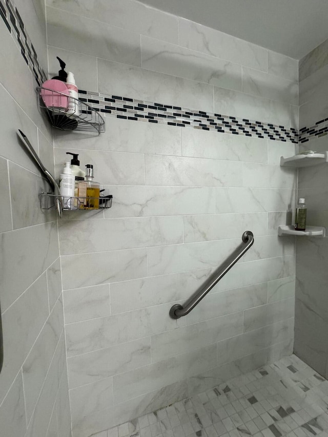 bathroom with tiled shower