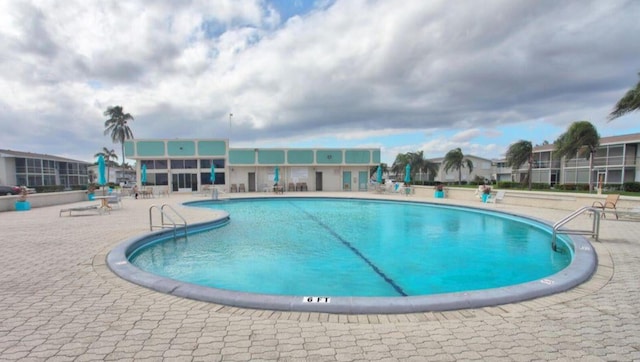 view of pool featuring a patio