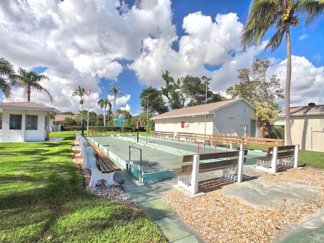 view of swimming pool featuring a lawn