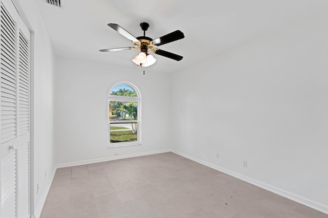 unfurnished room with ceiling fan