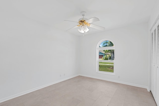 spare room with ceiling fan