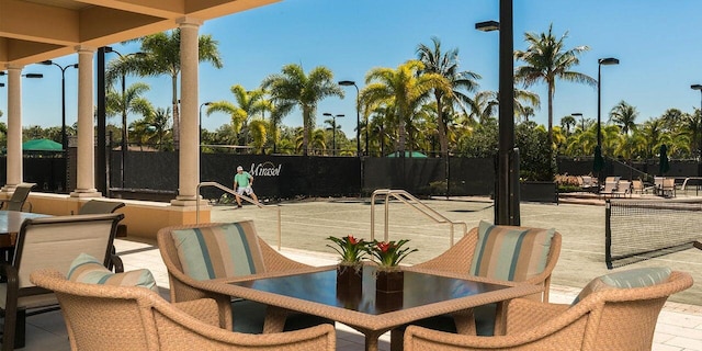 view of patio featuring tennis court