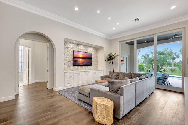 living room featuring dark hardwood / wood-style floors and ornamental molding