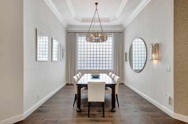 dining area with a notable chandelier, dark hardwood / wood-style flooring, crown molding, and a tray ceiling