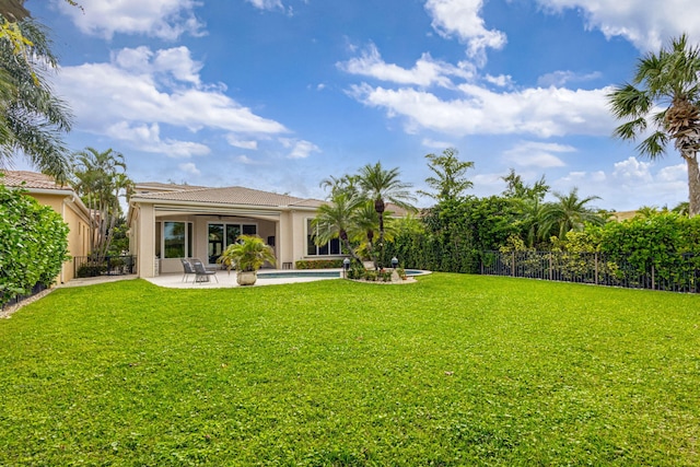 view of yard featuring a patio and a fenced in pool