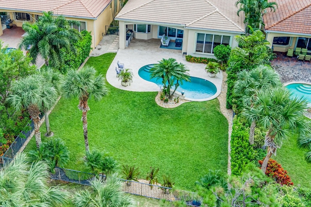 view of pool featuring a yard, a patio, and an outdoor living space