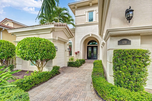 entrance to property featuring french doors