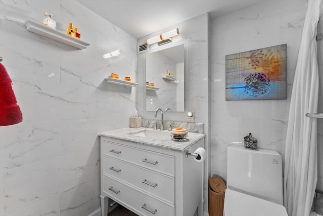 bathroom featuring vanity and toilet